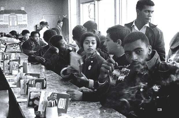 Judy Richardson (center, holding notebook) with other SNCC staff workers