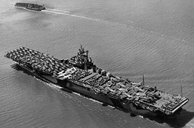 Black and white Photo of aircraft carrier in ocean waters