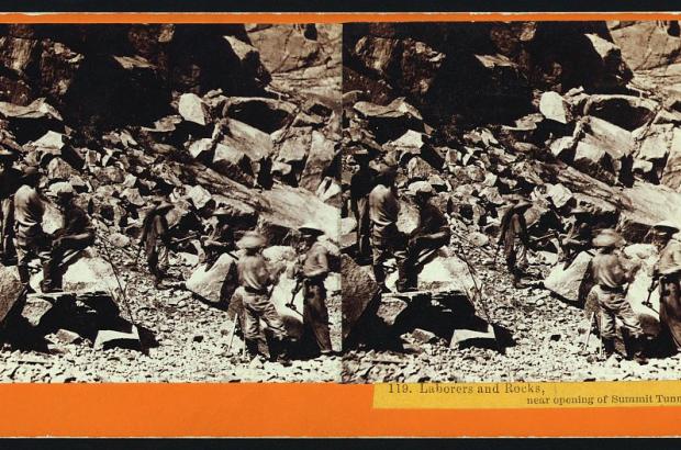 stereograph shows laborers and rocks at opening of tunnel