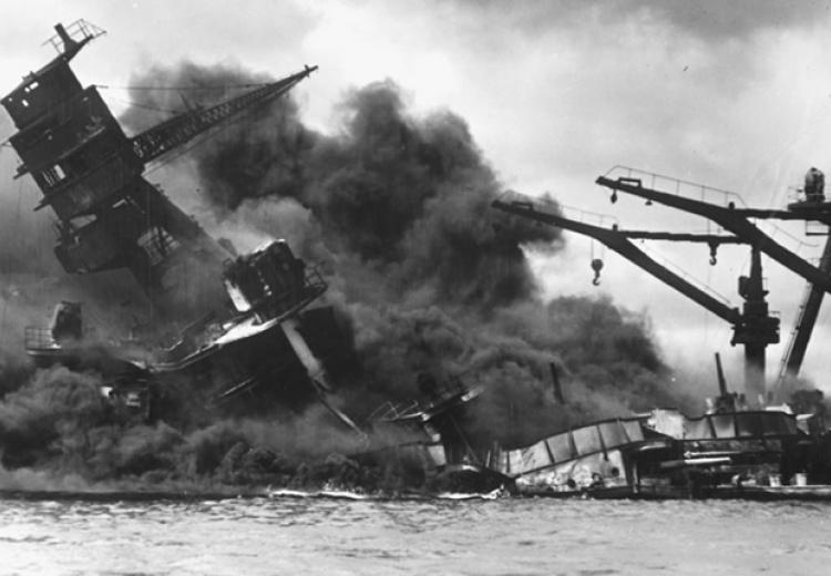 The battleship USS Arizona sinks after being hit by a Japanese air attack on Pearl Harbor