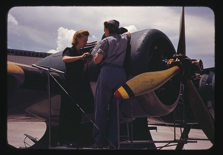 Bowen, a riveter, and Olsen, her supervisor, in the Assembly and Repair Dept. at the Naval Air Base in Corpus Christi, Texas (August, 1942).