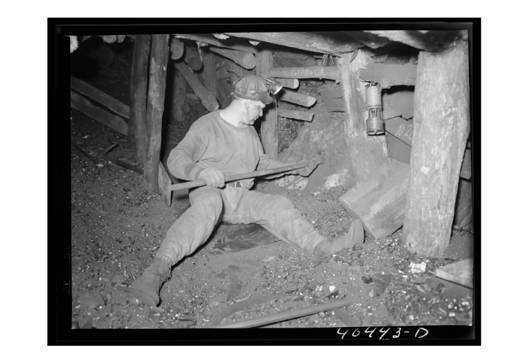 Joe Gladski, a coal miner at Maple Hill mine in Shenandoah (Schuylkill County, PA), sets dynamite in a mine shaft in 1938. Photograph by Sheldon Dick of the Farm Security Administration.