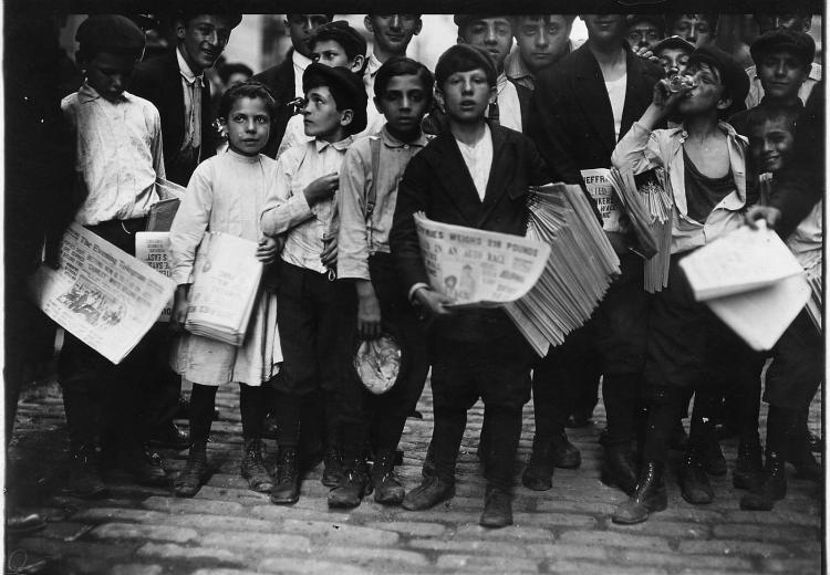 Newsboys and newsgirl in New York City getting afternoon papers (July, 1910).