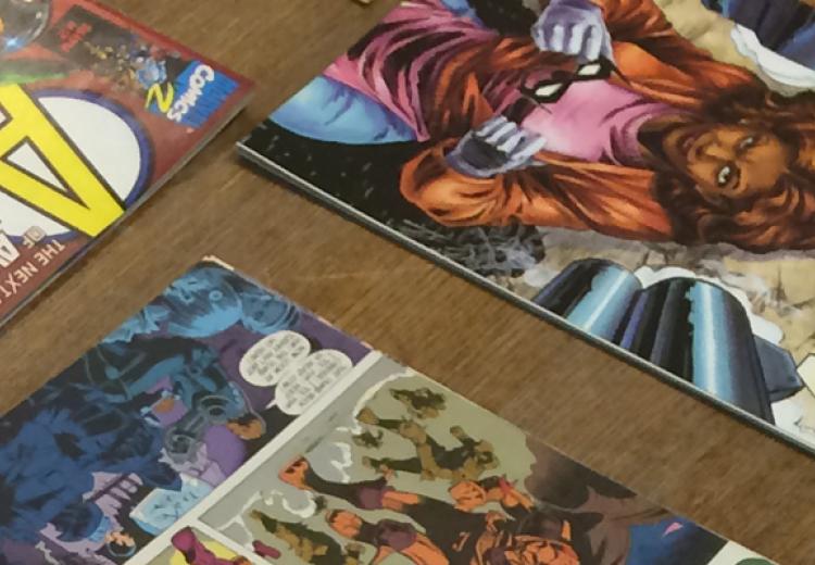 Colorful comic book covers displayed on table