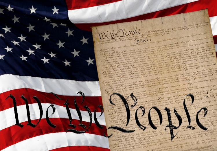 Image of the U.S. flag and the U.S. Constitution with the words "We the People" in the forefront. 
