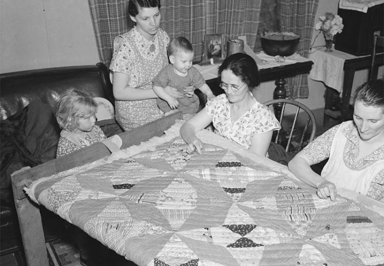 A quilting party in an Alvin, Wisconsin home.